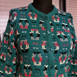 Vintage Long sleeve button up hand knitted cardigan. No tags. Size medium.